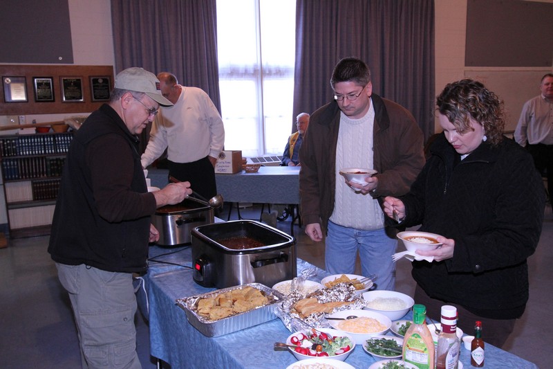 Lions Chili Lunch - King Leo Jim Bailey serves chili. Lion Jim Kolb in background